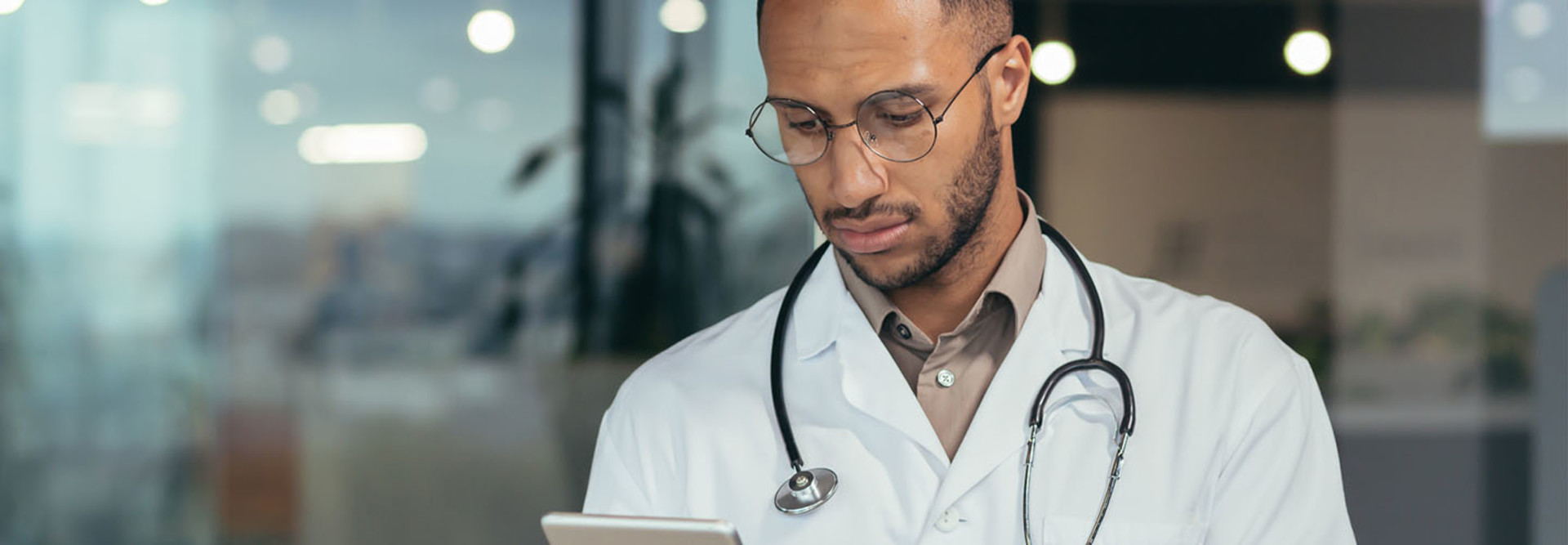 Doctor using tablet computer