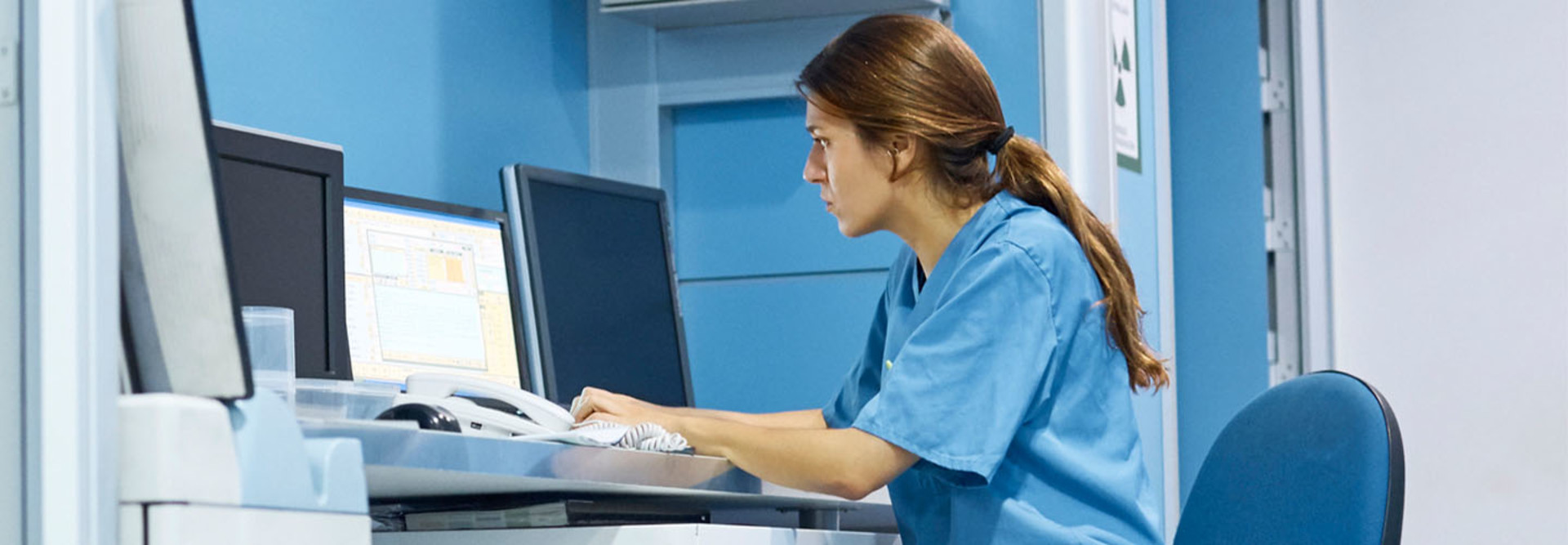 Nurse working on computer in hospital