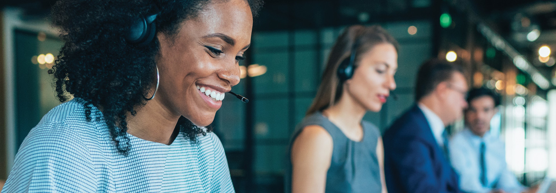 Female wearing headphones working in office