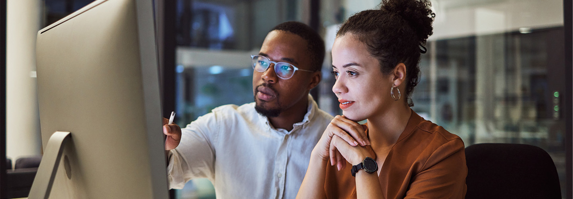 IT team members look at platform on desktop