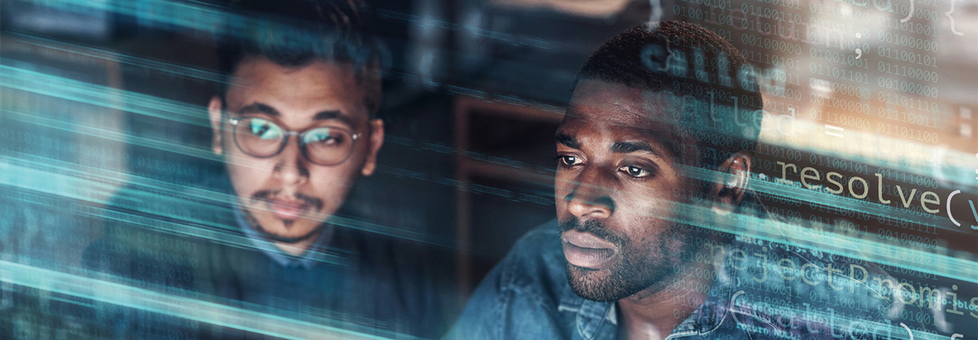 two IT staff look at monitor concerned with blue code on top of the image