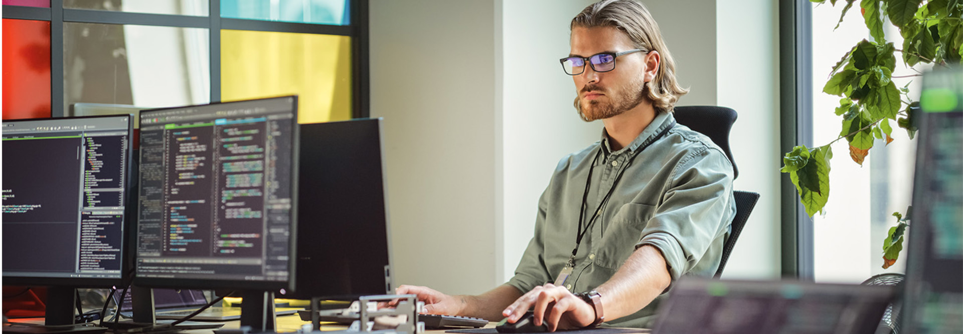 IT person looks at computer screen filled with code