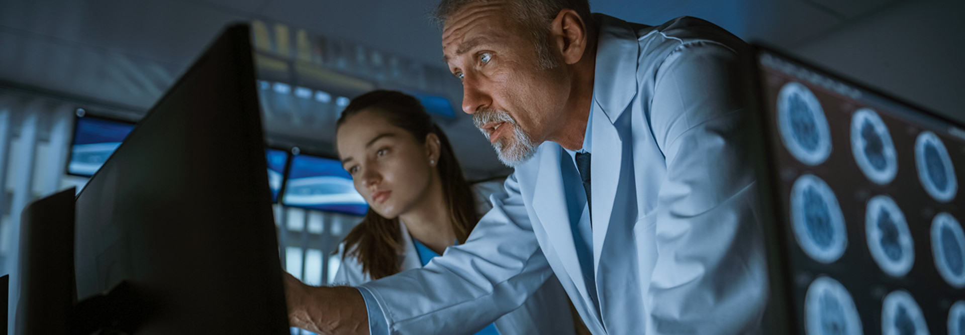 two doctors assess MRI images