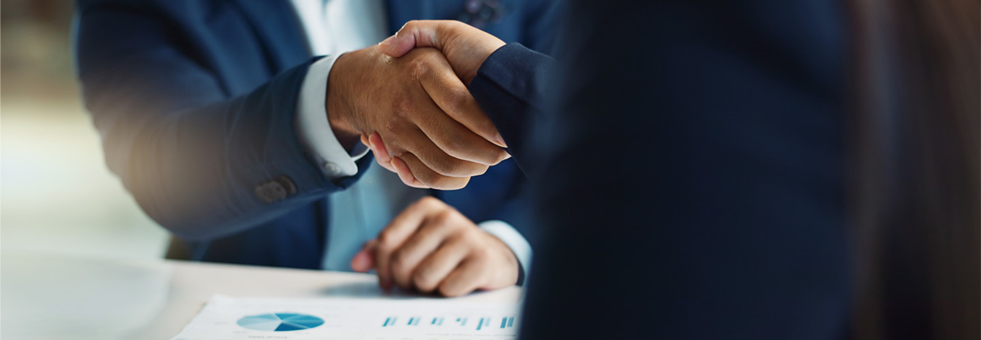 two men shake hands