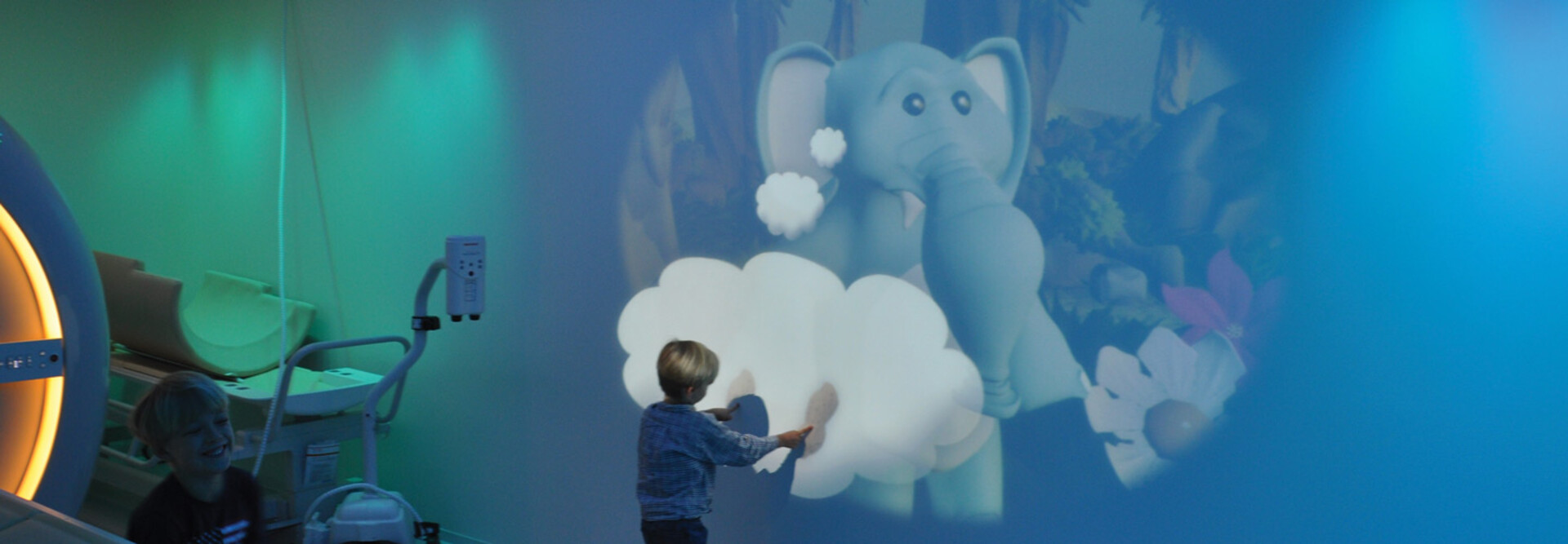 child plays with projection at hospital