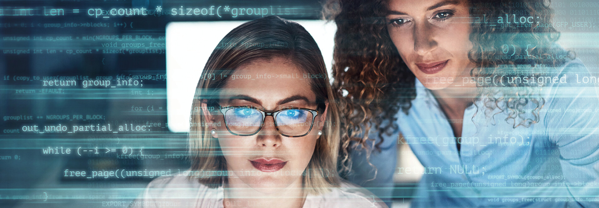IT staff look at malicious code