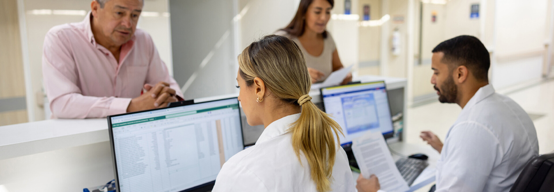 Doctors using computers at a hospital