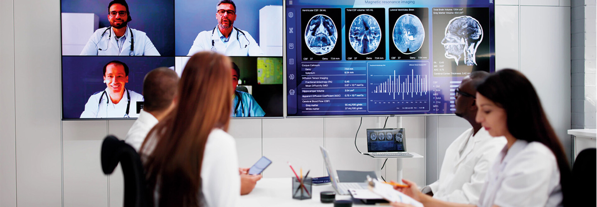 healthcare professionals participate in a hybrid meeting