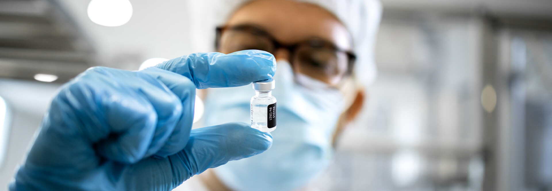 Pharmaceutical worker reviewing vaccine