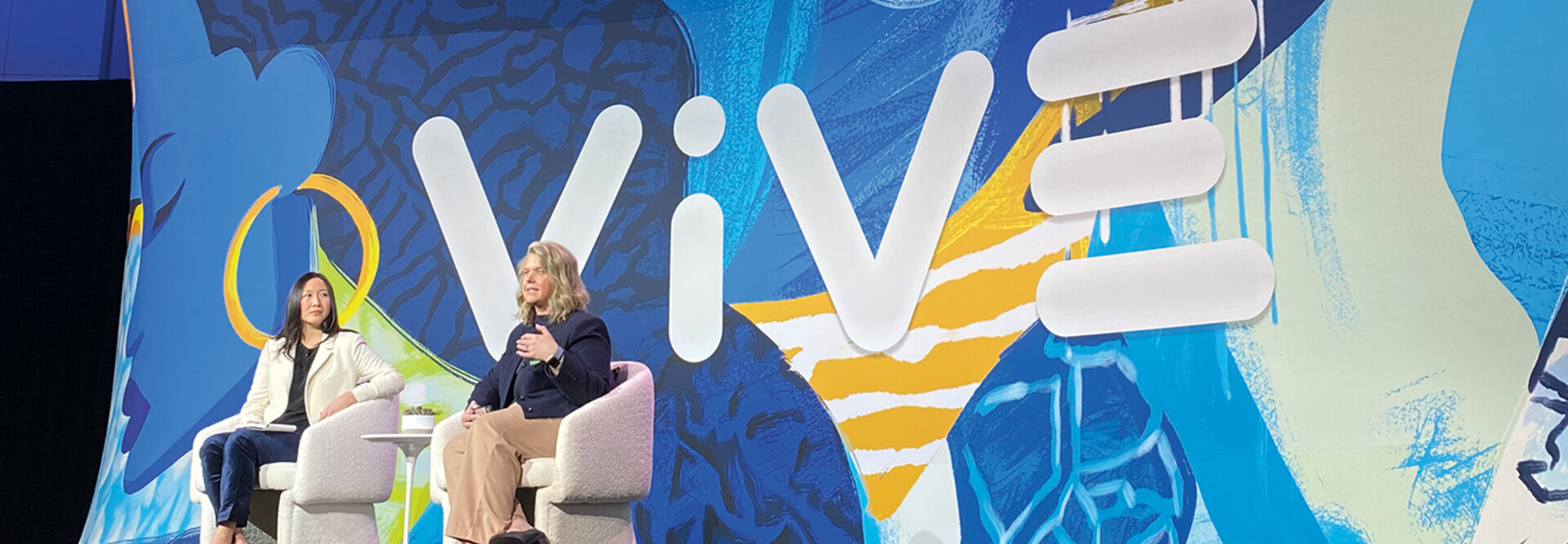 Julia Chou and Ryannon Frederick on stage at ViVE 2025