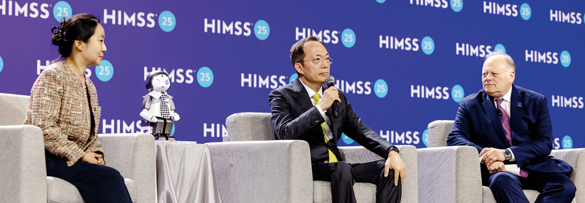 panelists on stage at HIMSS25