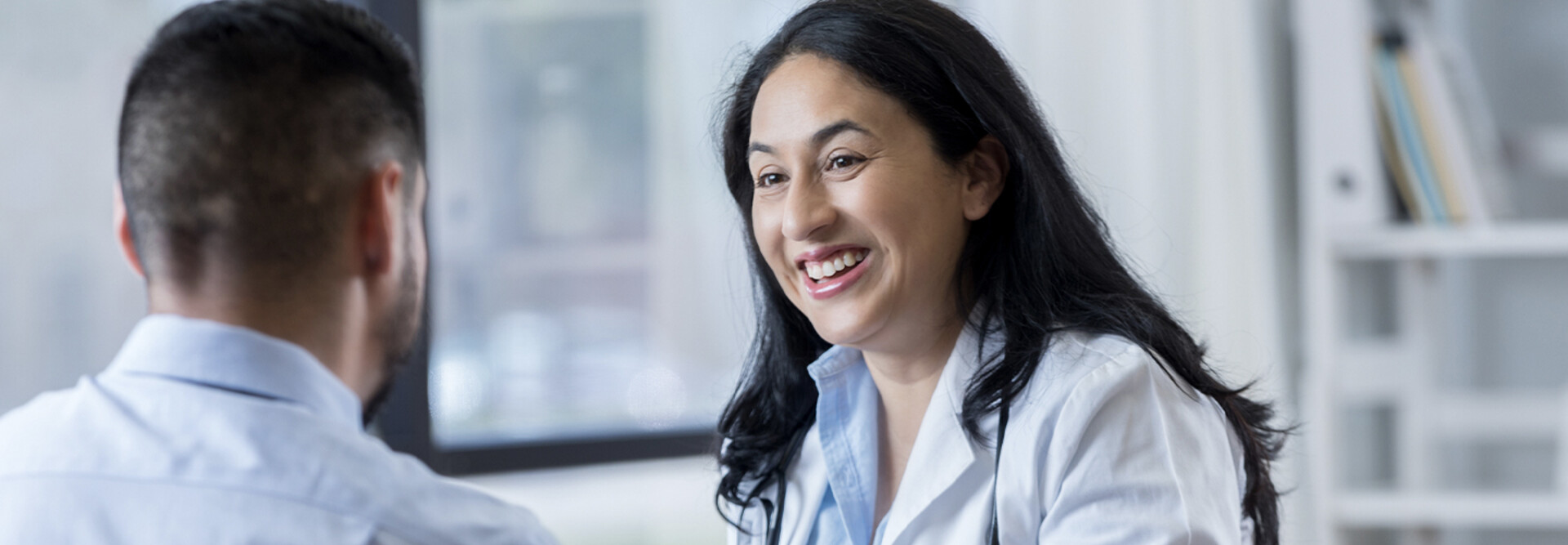 Doctor conversing with patient