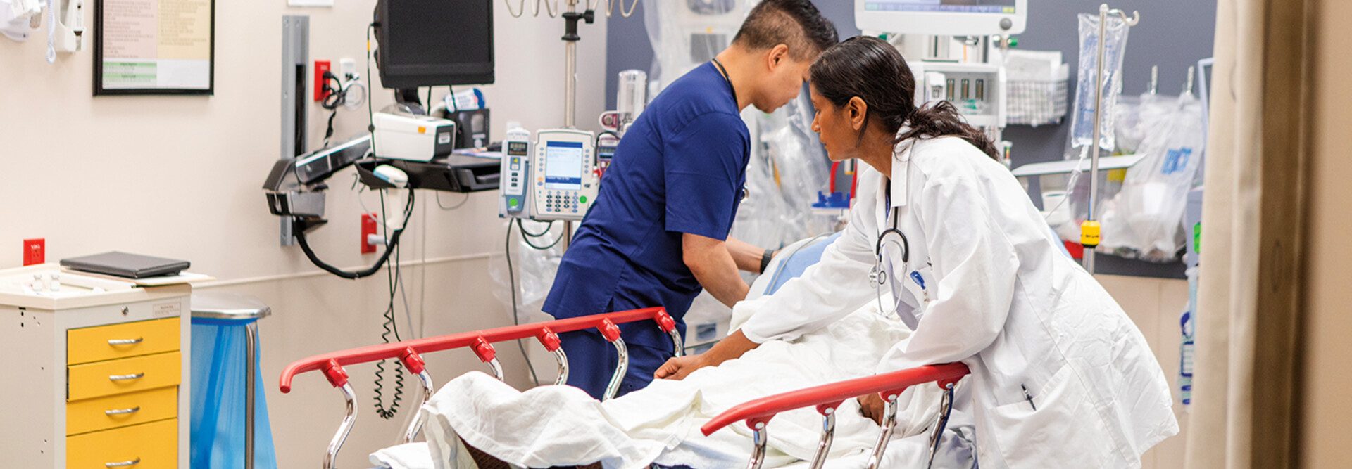 doctors take care of patient in the ER