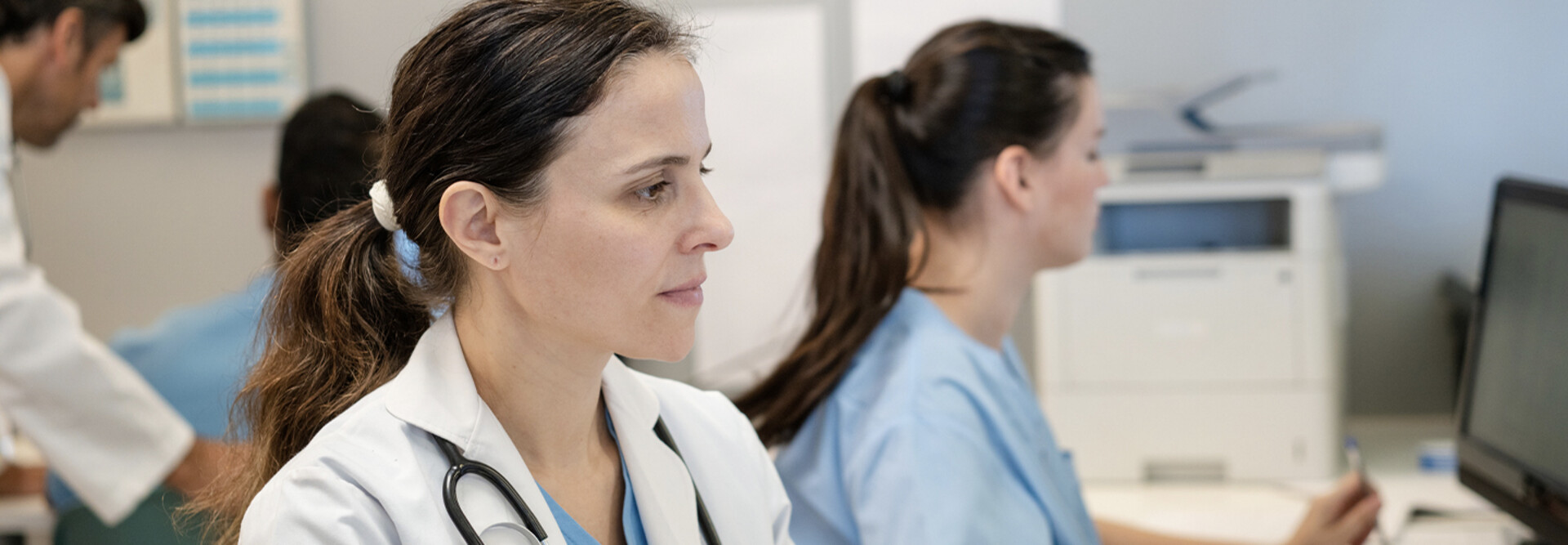 Doctors using computers in a hospital