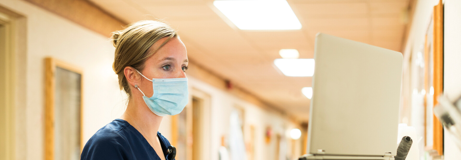 Doctor using medical laptop in hospital