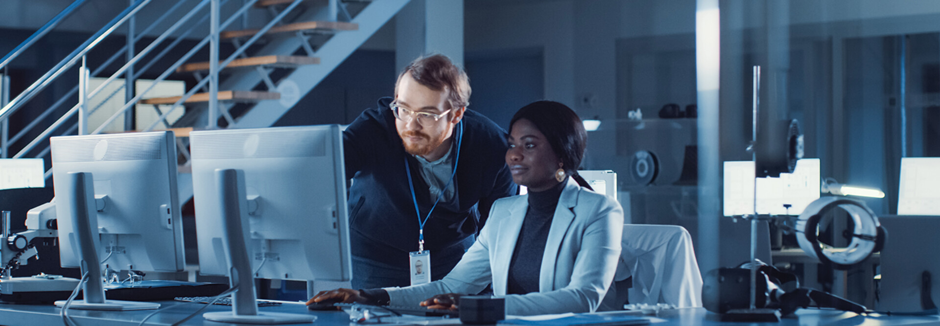 IT team confers over monitor