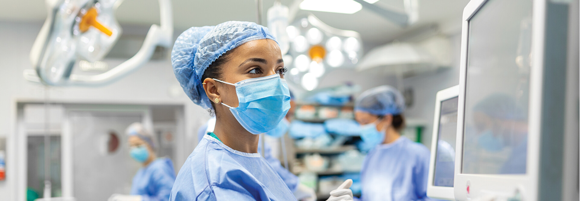 nurse check monitor in the OR
