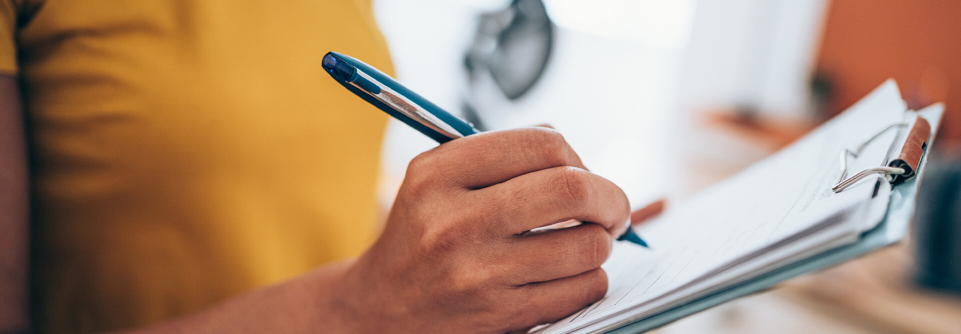Person with a clipboard checking a list