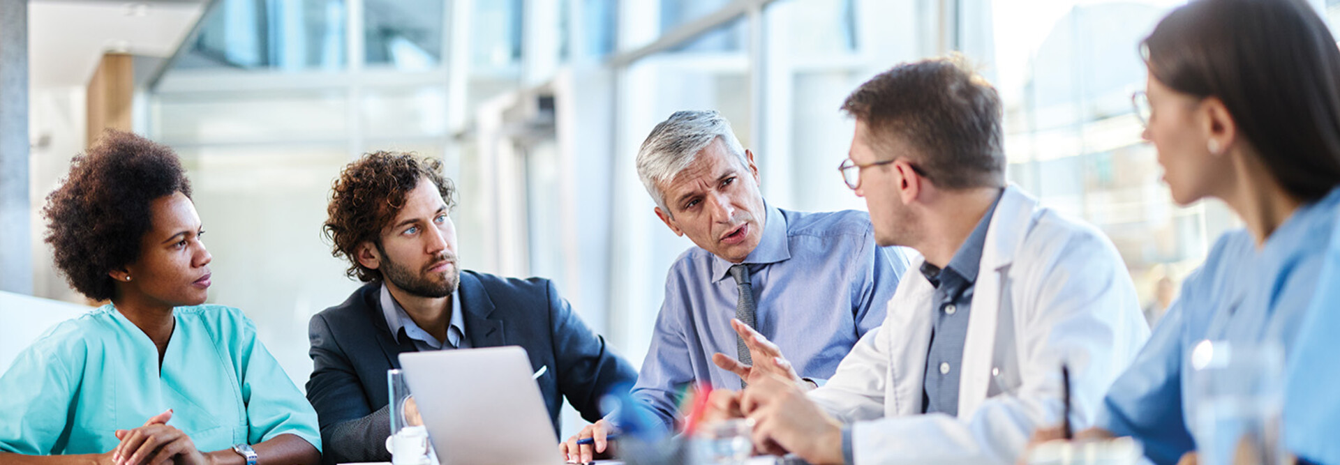 healthcare team have discussion around table