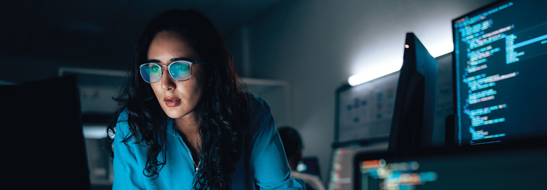 cybersecurity expert surrounded by code