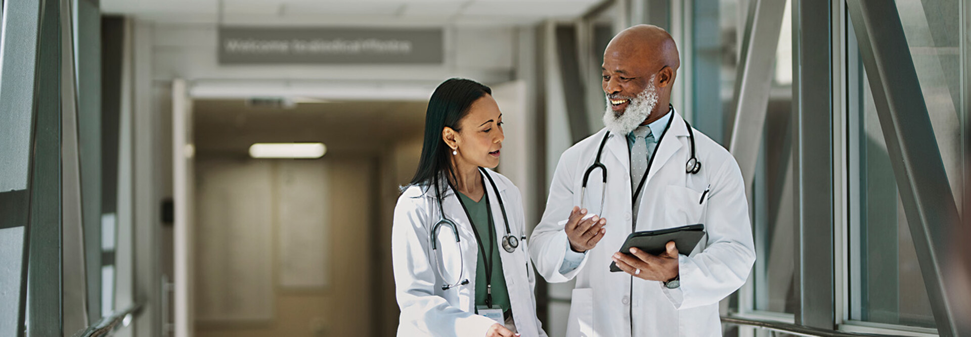 two doctors smile as they walk