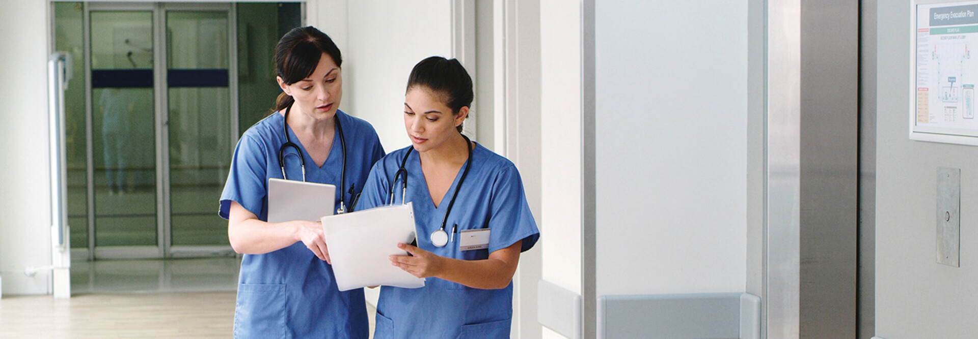nurses with paper charts