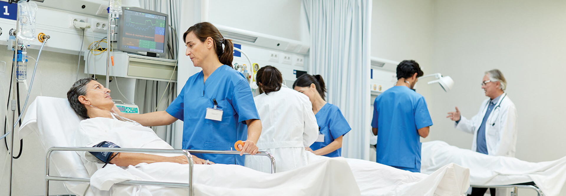 nurses talk to patients on gurneys