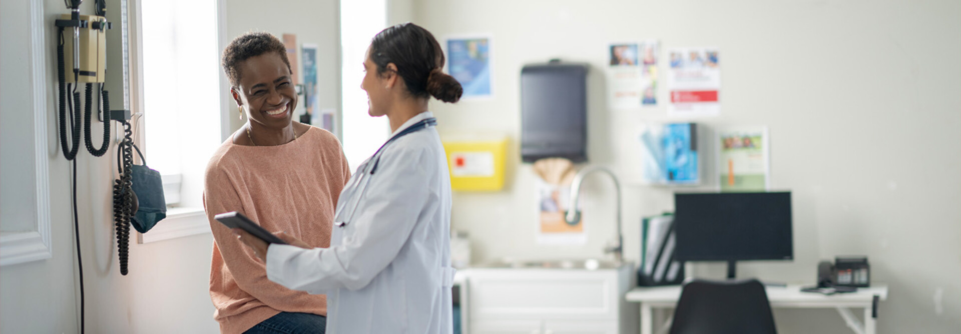 doctor and patient smiling at appointment