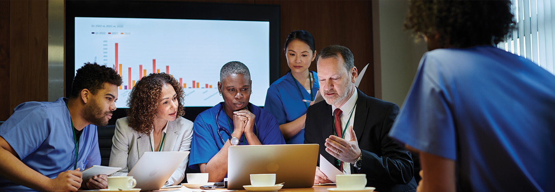 healthcare leaders meet around table