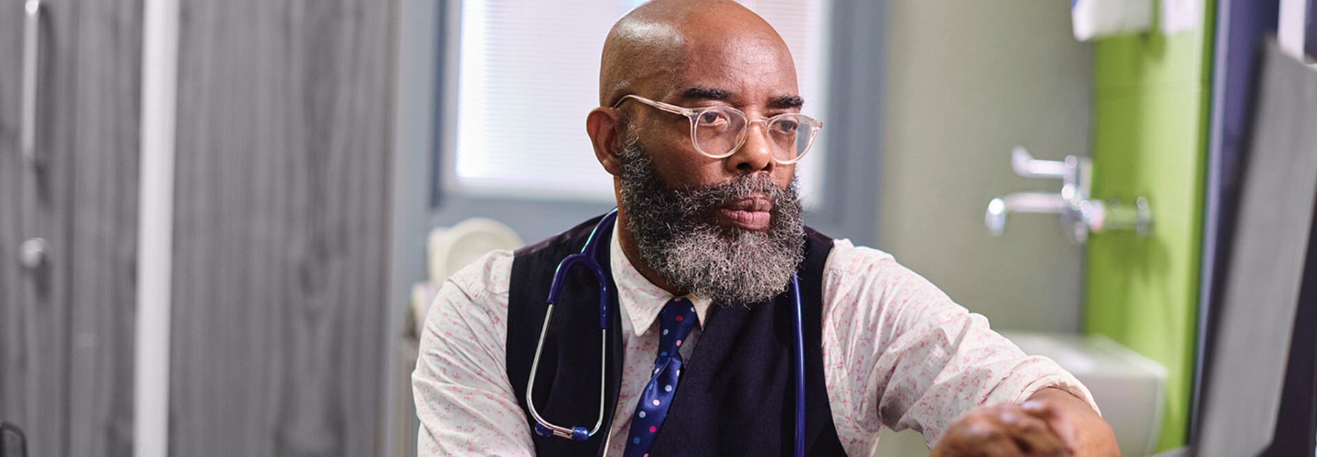 Physician working on a computer