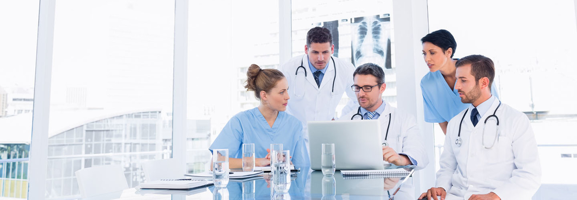 Doctors gathered around discussing issue