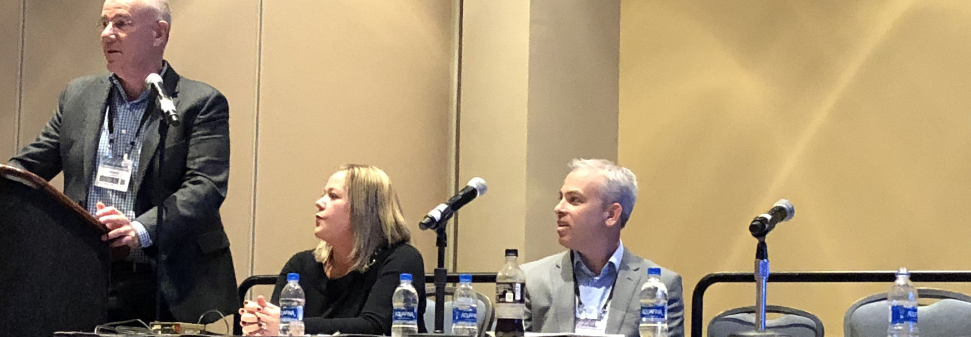 Microsoft Health's Dr. Clifford Goldsmith (left) talks at LeadingAge 2018 about the potential of artificial intelligence in senior care with MatrixCare's Megan Lenthe and Joe Weber.