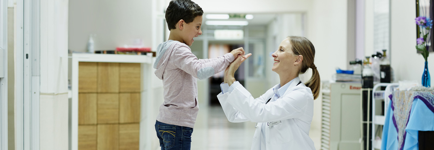 Child high fives doctor