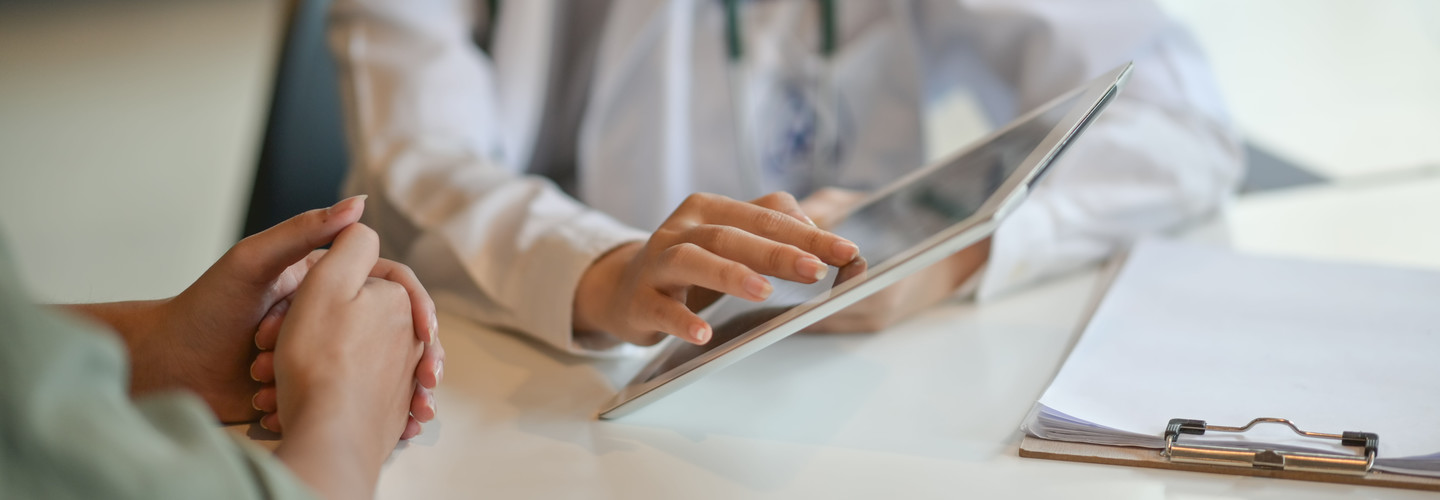 Mobile devices in Healthcare, Doctor uses tablet to show patient data