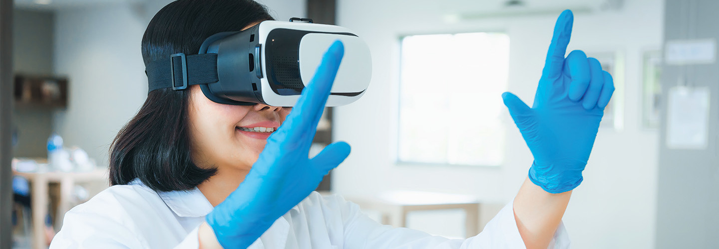 resident in white coat trains using virtual reality glasses