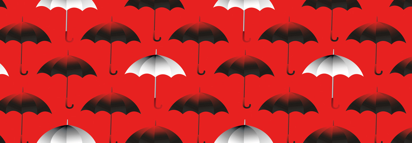 black and white umbrellas on red background