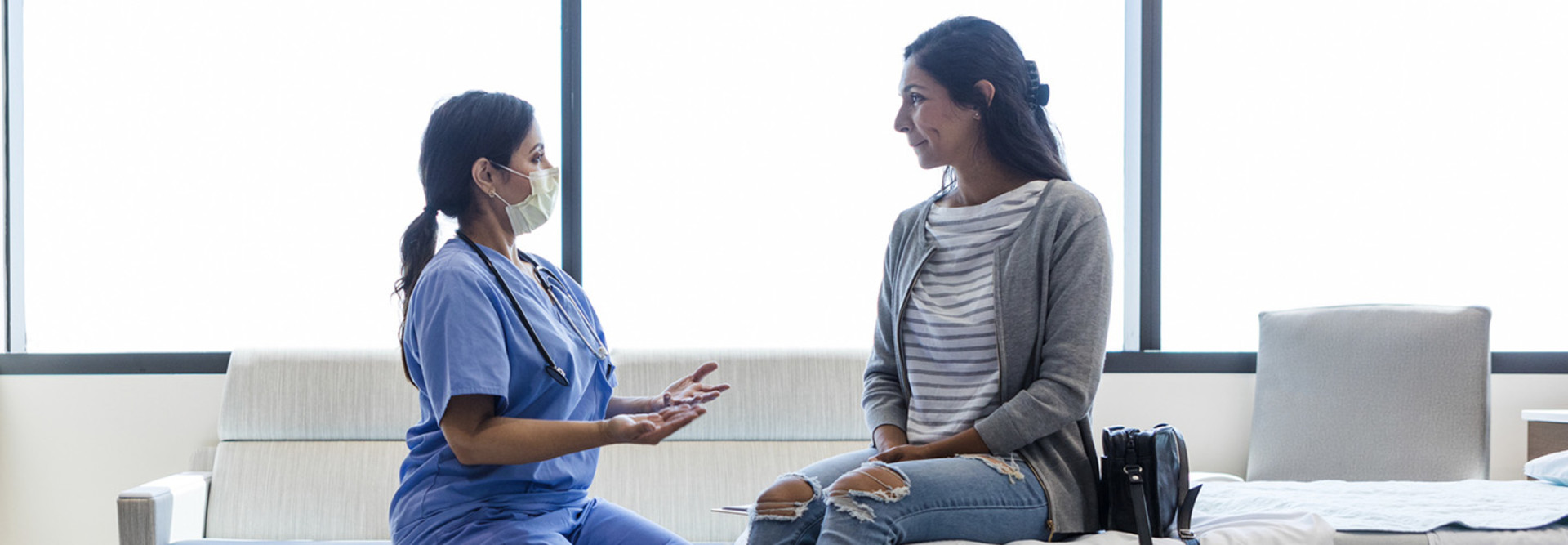 Doctor talking to patient in ER