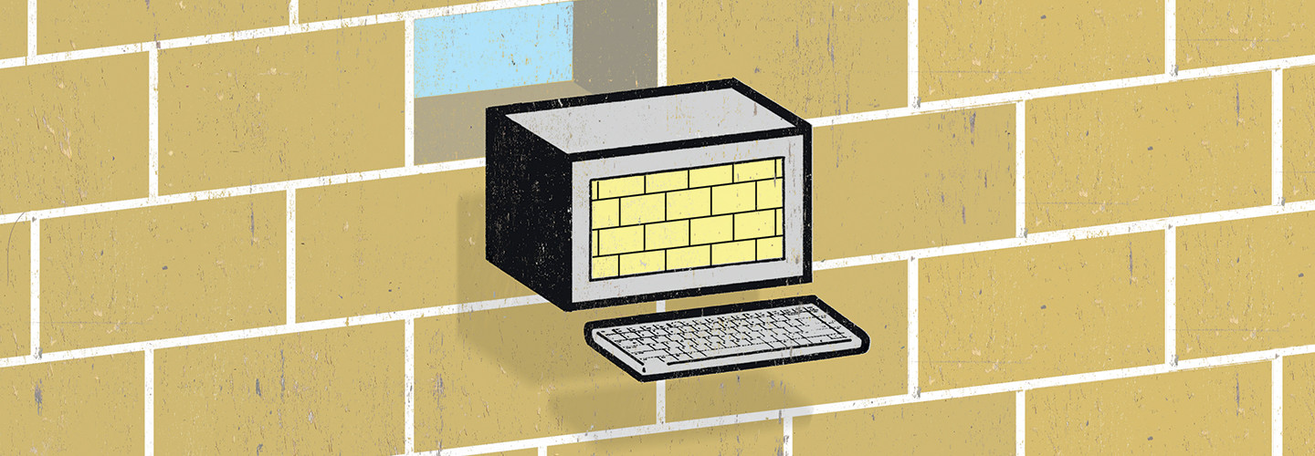 computer "brick" in front of brick wall concept