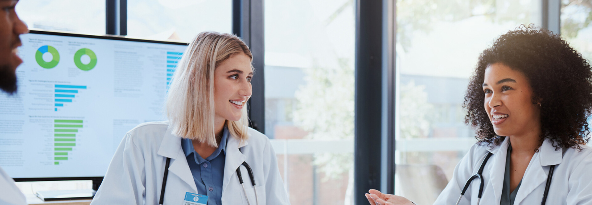 Doctors discussing data in a meeting