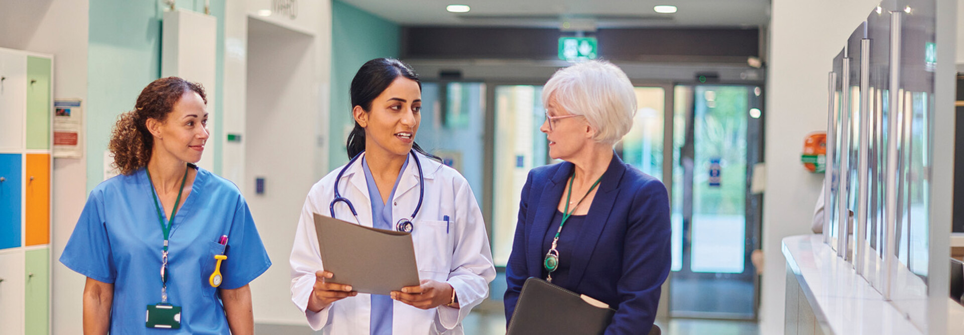 Hospital workers walking down a hallway