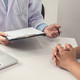 A doctor consults a patient.