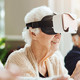 seniors smile while using virtual reality 
