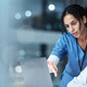 nurse and physician collaborate over laptop