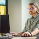 IT person looks at computer screen filled with code