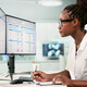 Women at desk working on computer