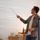 man teaches coding class using projector