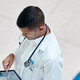 Doctor reviewing health record