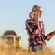 Person in rural setting talking on phone