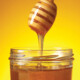 jar of honey with a honey dipper