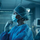 Surgeon looks at brain on a display in the OR